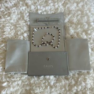 Cultured Freshwater Pearl Necklace and Bracelet in pink and gray shades.